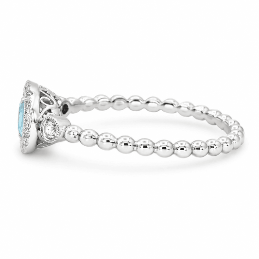 Oval Blue Topaz and Diamond Ring