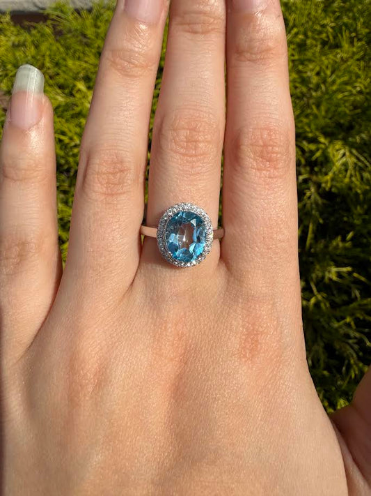 0.20 CT TW. Diamonds and Blue Topaz Halo Ring