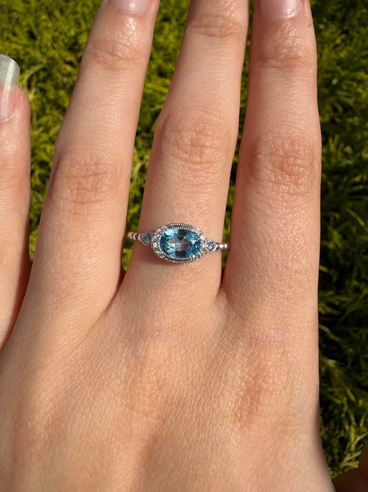 Oval Blue Topaz and Diamond Ring