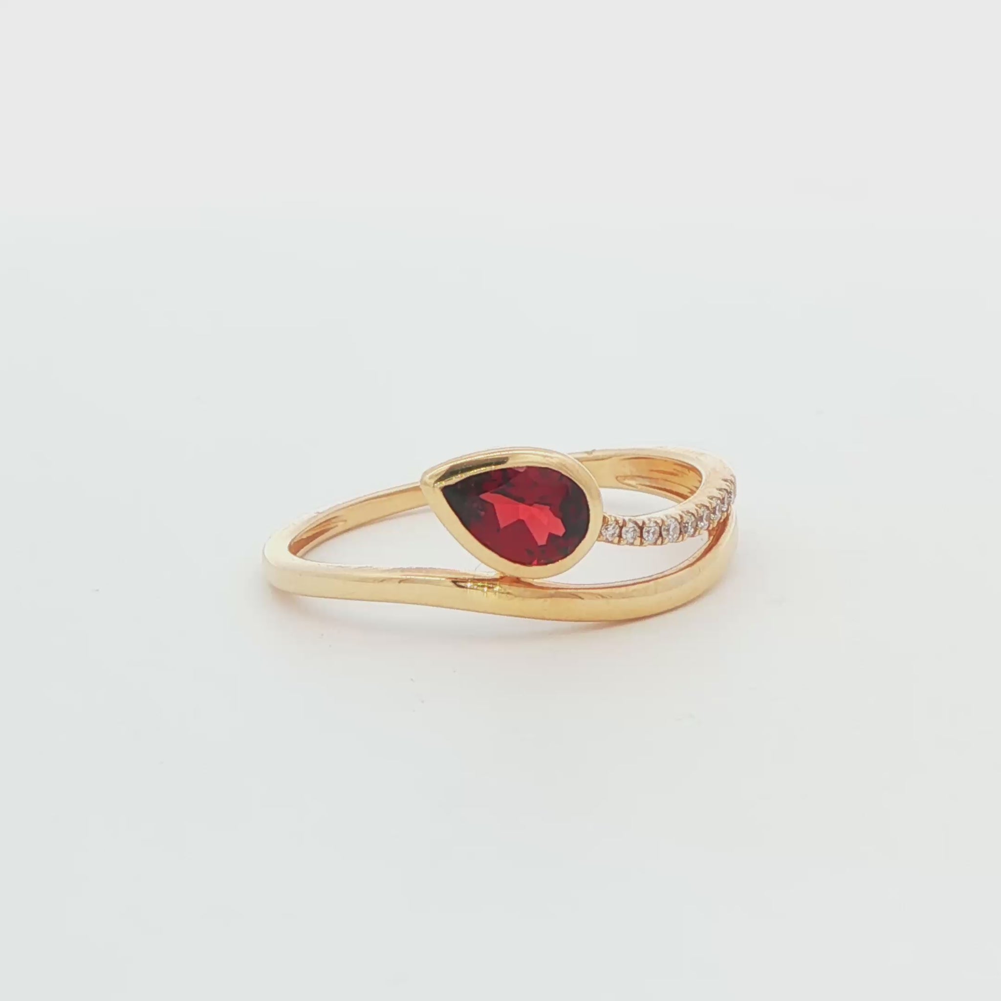 14K YG GARNET SEMI PEAR DIA BYPASS RING