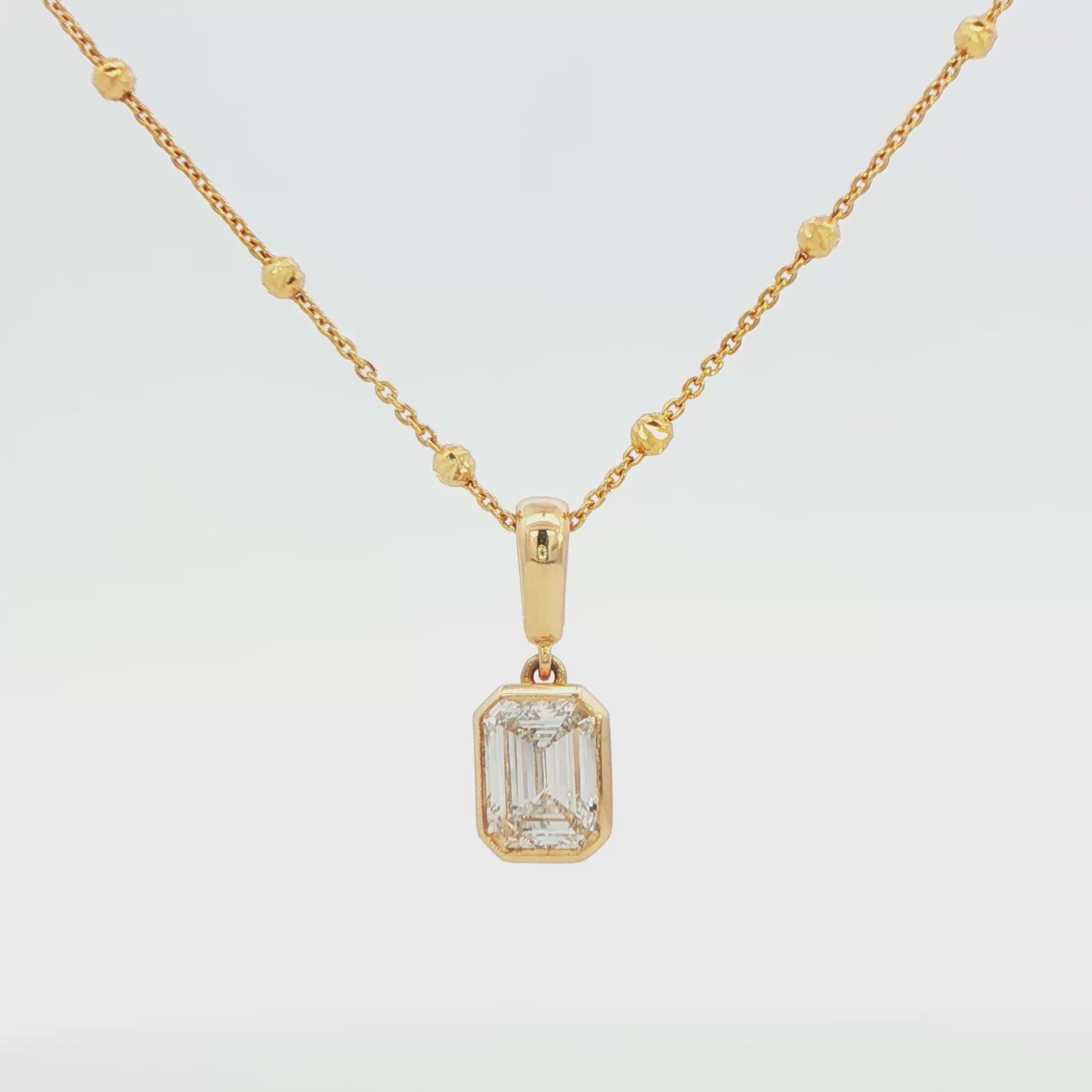 14K YG LG EMERALD CUT DIA 1.00 CTW  BEZEL PNDT