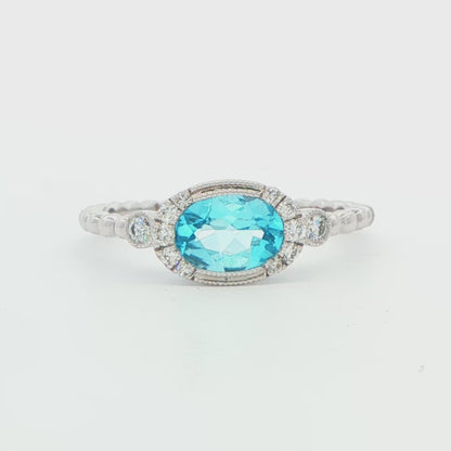 14K WG TOPAZ SEMI OVAL BALL RING