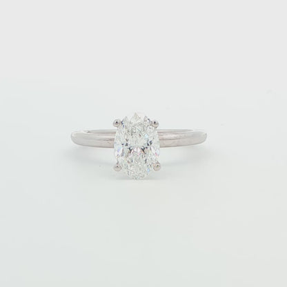 14K WG 1.53 CTW OVAL LG DIAMOND IN DIA SCULPTED UNDER HALO RG .06CTTW.