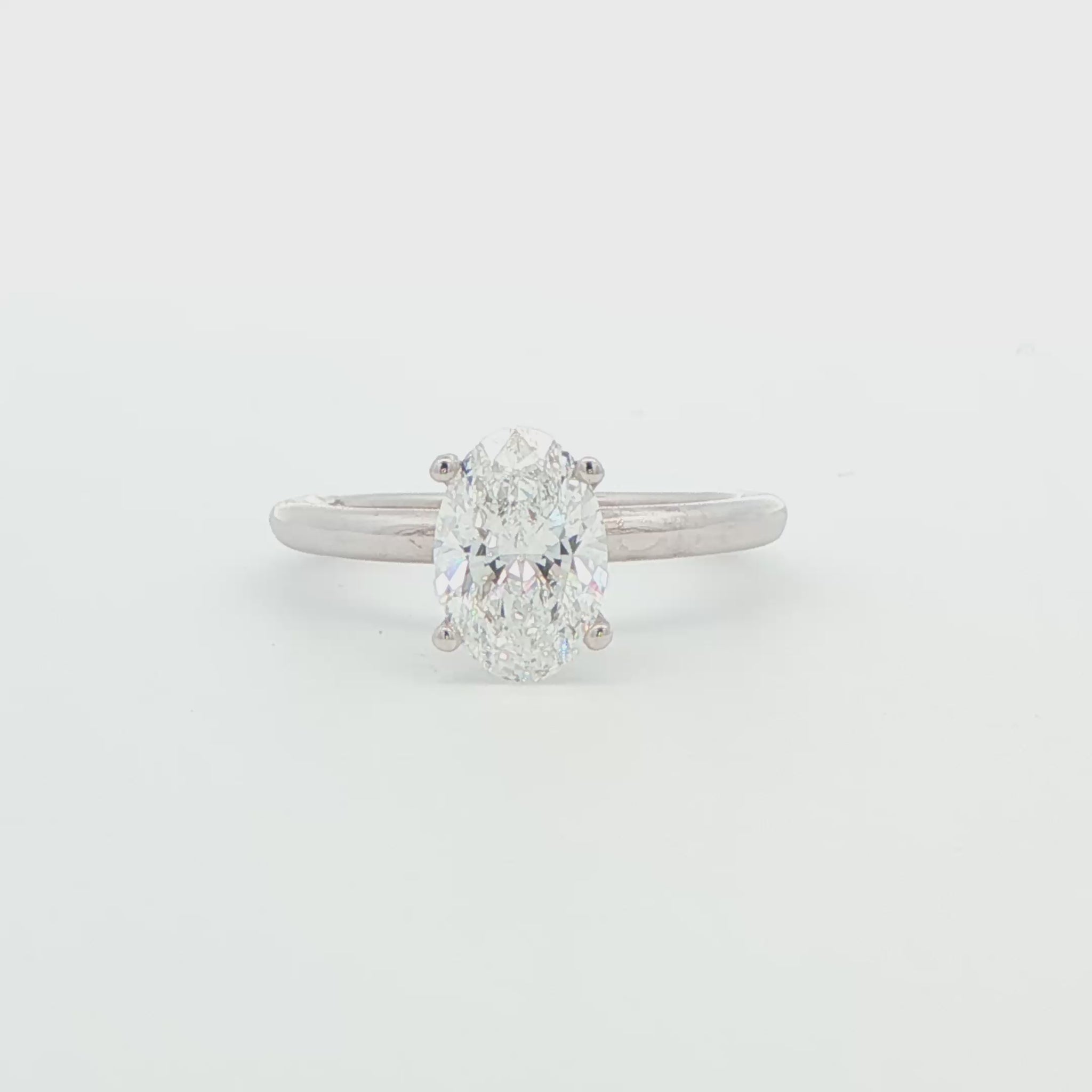 14K WG 1.53 CTW OVAL LG DIAMOND IN DIA SCULPTED UNDER HALO RG .06CTTW.