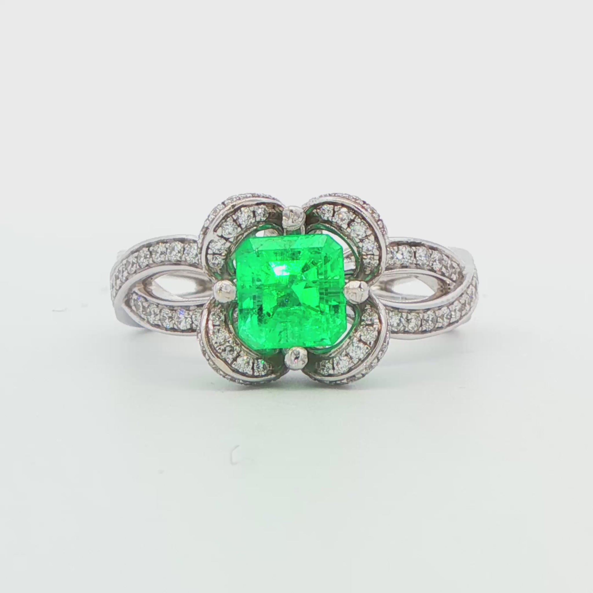 Emerald and Diamond Flower Halo Ring